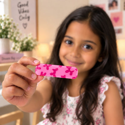 Poodle hair clip by Zootii held in hand: pink clip with a deeper pink balloon-poodle print
