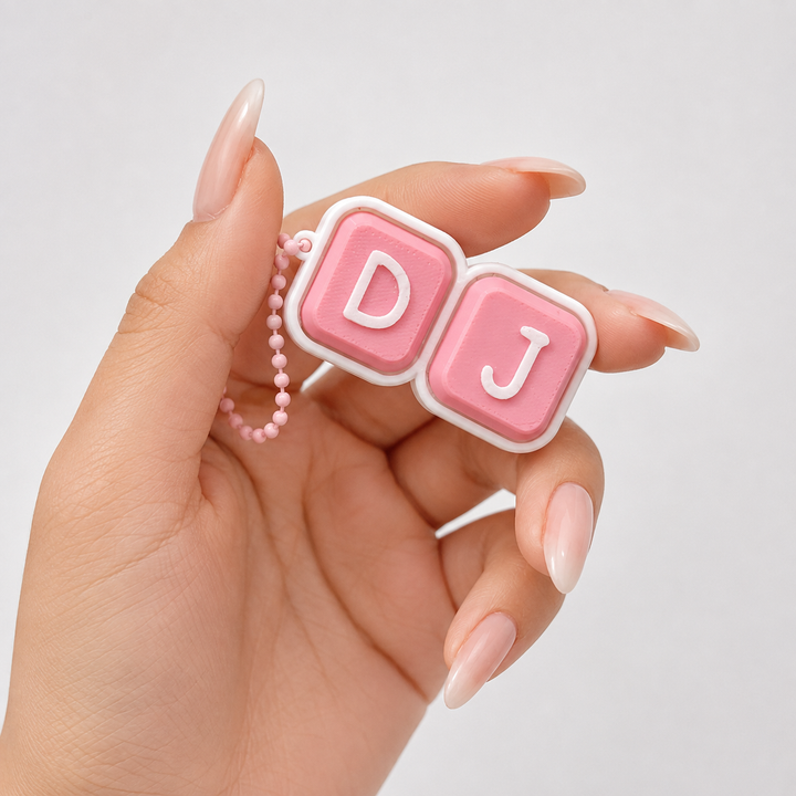 Pink personalised clicker bag charm with custom initials