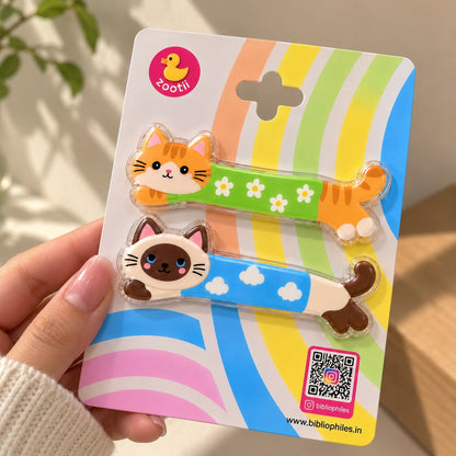 Kittens Day hair clips by Zootii: 2 cat snap clips on the zootii card, held in hand