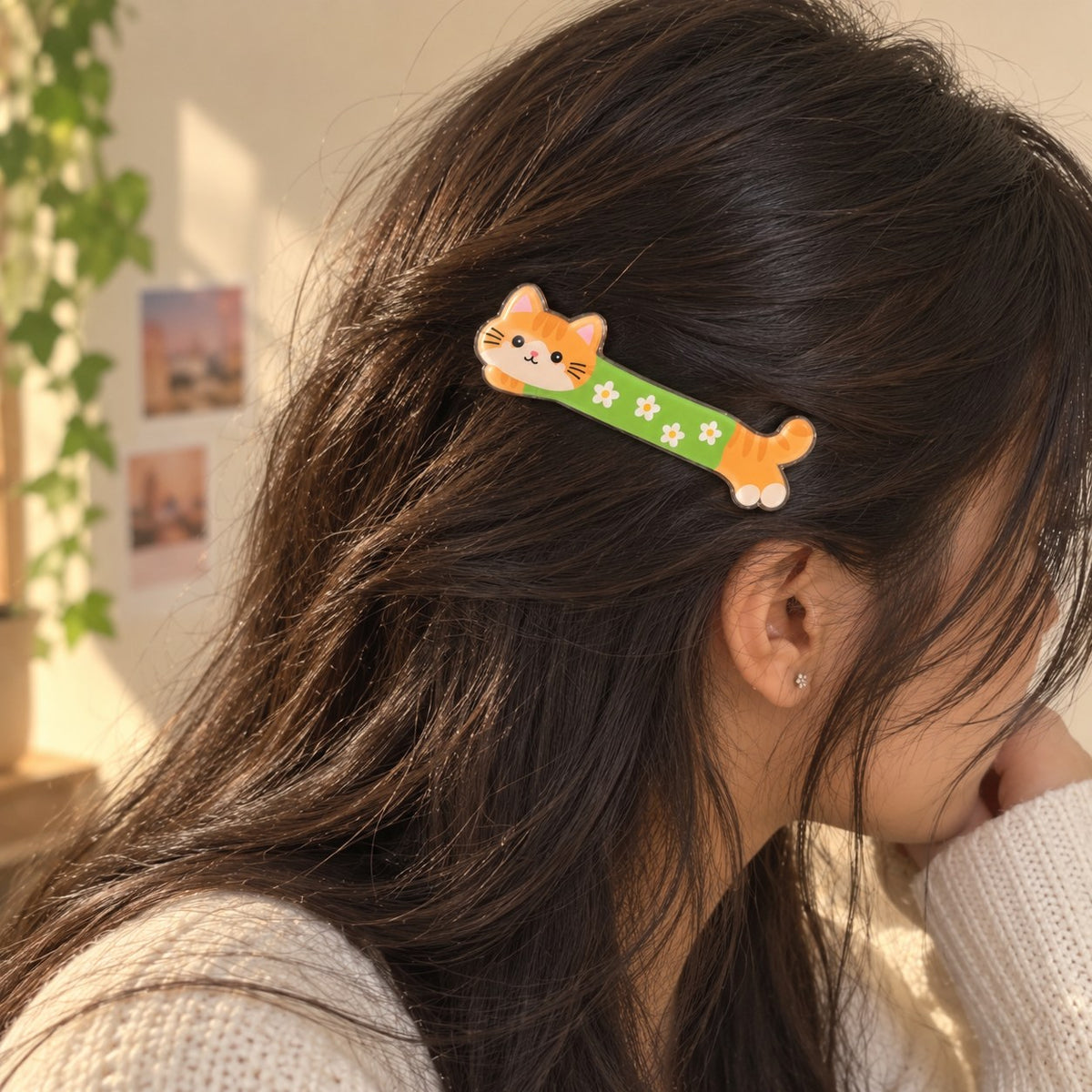 Kittens Day cat hair clip worn on a side parting