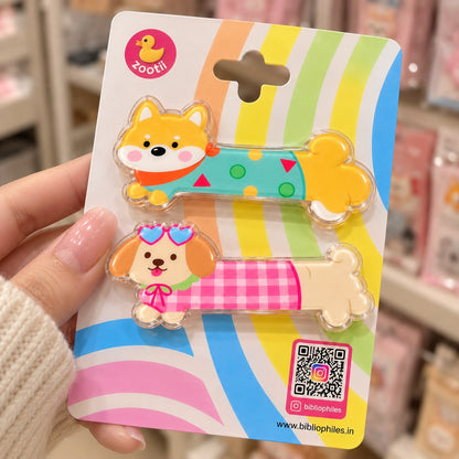 Puppies Day hair clips by Zootii: 2 dog snap clips on the zootii card, held in hand